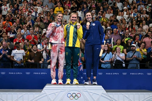 Silver medallist Canada's Summer Mcintosh (L), gold medallist Australia's Ariarne Titmus and bronze medallist US' Katie Ledecky pose with their medals on the podium of the women's 400m freestyle swimming event at the Paris 2024 Olympic Games at the Paris La Defense Arena in Nanterre, west of Paris, on July 27, 2024.