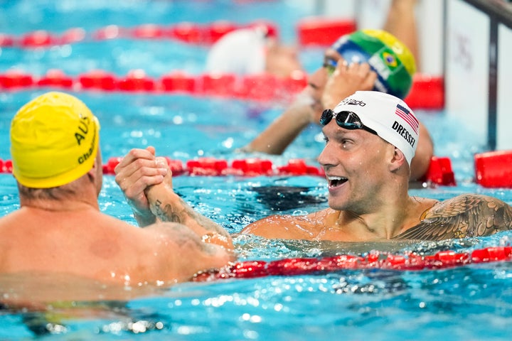 Caeleb Dressel, of the United States, right, and Kyle Chalmers, of Australia, shake hands after a heat in the men's 4x100-meter freestyle relay at the 2024 Summer Olympics, Saturday, July 27, 2024, in Nanterre, France.