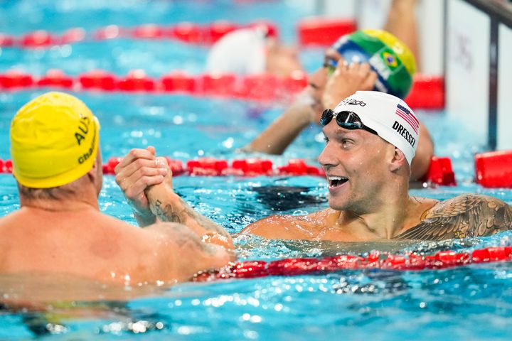 Caeleb Dressel, of the United States, right, and Kyle Chalmers, of Australia, shake hands after a heat in the men's 4x100-meter freestyle relay at the 2024 Summer Olympics, Saturday, July 27, 2024, in Nanterre, France.