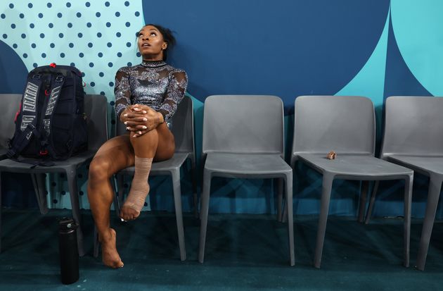 Biles turned pensive after her leg got wrapped.