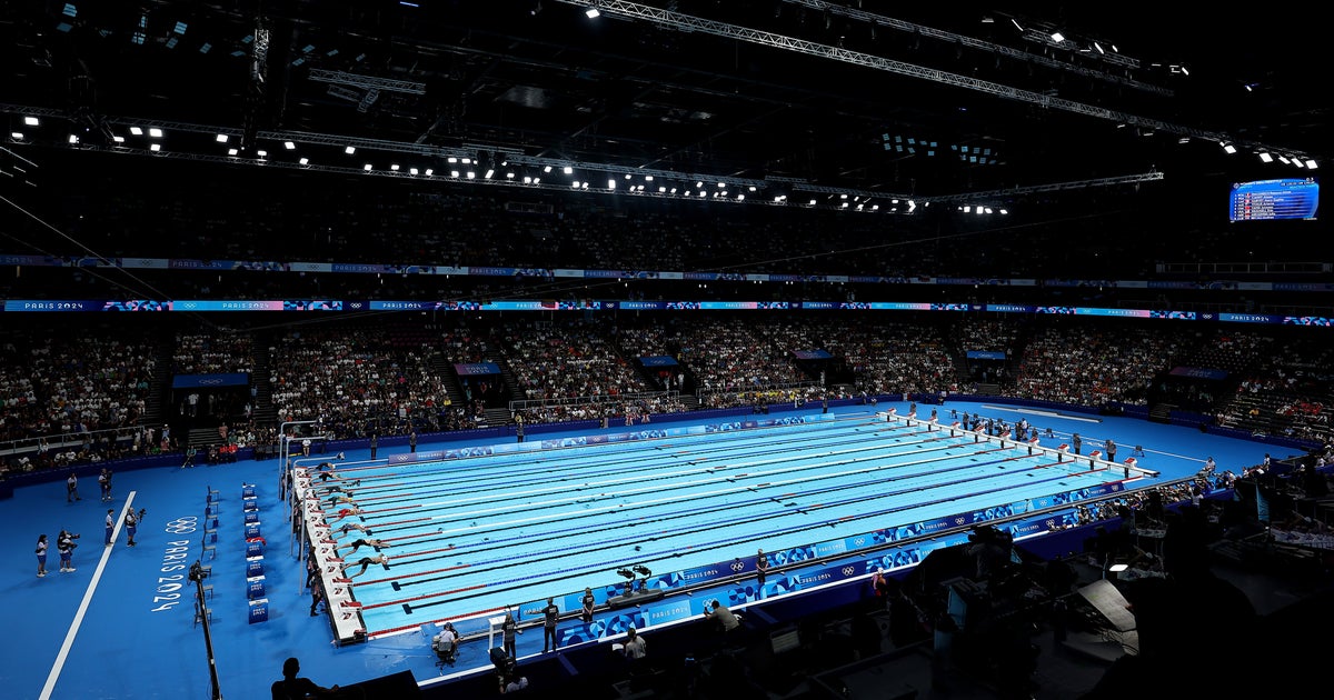 NextImg:Man In Speedo Named 'Bob The Cap Catcher' Wins Hearts At Olympic Swim Competition