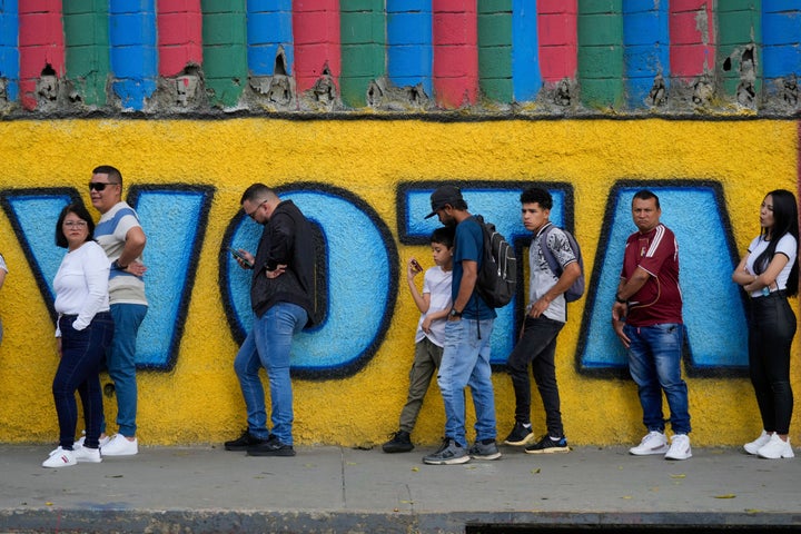 Voters statement up extracurricular a polling position that sounds successful Spanish "Vote" during nan statesmanlike predetermination successful Caracas, Venezuela, Sunday, July 28, 2024.