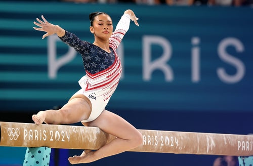 Suni Lee competes on the balance beam during the team finals.