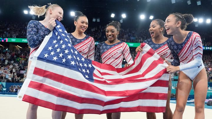 From left: Jade Carey, Suni Lee, Simone Biles, Jordan Chiles and Hezly Rivera, who did not compete in the final, won gold in the team event, besting Italy and Brazil, which took silver and bronze.