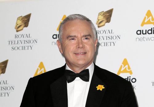 Journalist Huw Edwards poses for photographers upon arrival at the Royal Television Society Programme Awards at the Grosvenor Hotel in London, Tuesday, March 21, 2017.
