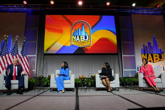 Republican presidential candidate former President Donald Trump, left, moderated by from left, ABC's Rachel Scott, Semafor's Nadia Goba and FOX News' Harris Faulkner, speaks at the National Association of Black Journalists convention.