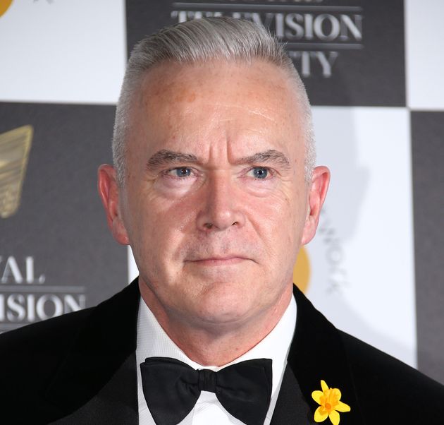 Huw Edwards poses for photographers upon arrival for a the Royal Television Society Awards in central London, Tuesday, Mar 19, 2019. 