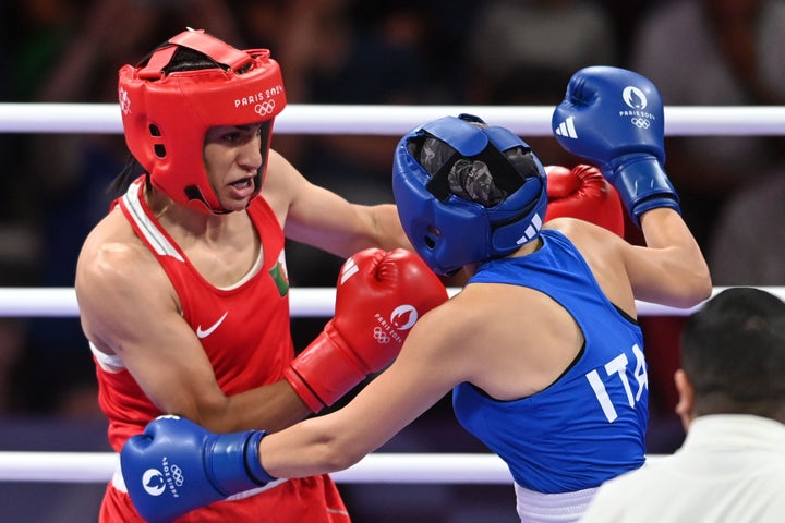 Algeria's Imane Khelif (in red) during the women's 66kg preliminary round match against Angela Carini of Italy (in blue). 