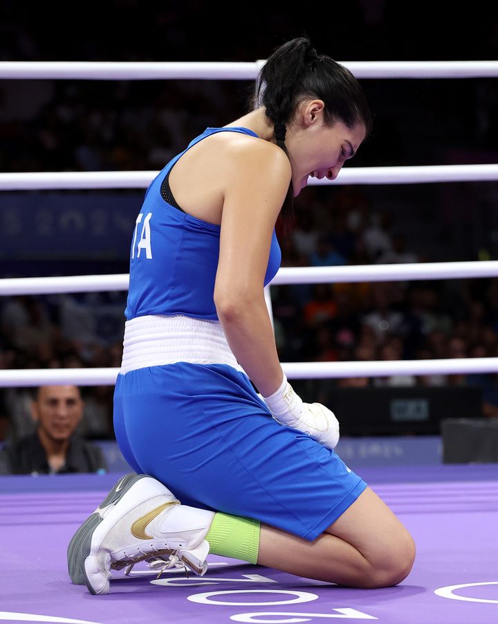 Angela Carini of Team Italy reacts after abandoning the Women's 66kg preliminary round match against Imane Khelif of Team Algeria in the first round.