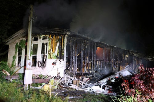 Firefighters work the scene of a deadly house fire early Wednesday, July 31, 2024 in Plant City, Florida.