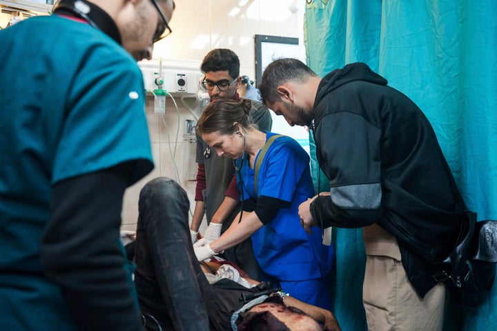 Dr. Tanya Haj-Hassan examines wounded children at Al-Aqsa Martyrs Hospital in Deir al-Balah, Gaza, on March 16. The "uncommitted" delegation set to attend the Democratic National Convention has asked that Haj-Hassan, an American pediatrician, be allowed to speak at the convention about the humanitarian crisis she has witnessed in Gaza.