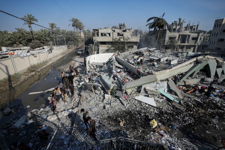 Palestinians inspect the rubble of a school destroyed in an Israeli airstrike on Deir al-Balah, central Gaza Strip, Saturday, July 27, 2024.