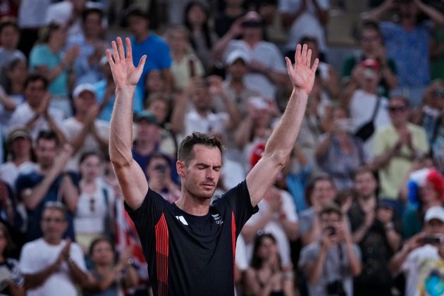 Andy Murray of Britain cries and waves to the spectators