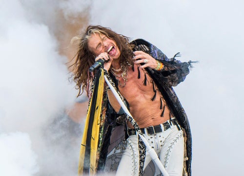 FILE - In this May 5, 2018 file photo, Steven Tyler of Aerosmith performs at the New Orleans Jazz and Heritage Festival in New Orleans. The iconic band behind hits like “Love in an Elevator” and “Livin' on the Edge” posted a statement Friday announcing the cancellation of remaining dates on its tour. (Photo by Amy Harris/Invision/AP, File)