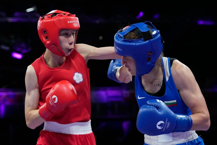 Taiwan's Lin Yu-ting, left, fights Bulgaria's Svetlana Staneva in their women's 57 kg quarterfinal boxing match. 