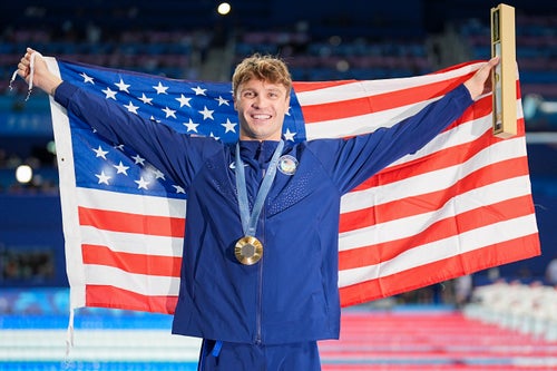 Bobby Finke of United States celebrates his gold medal after setting the world record in the 1,500 at the Paris Olympics.