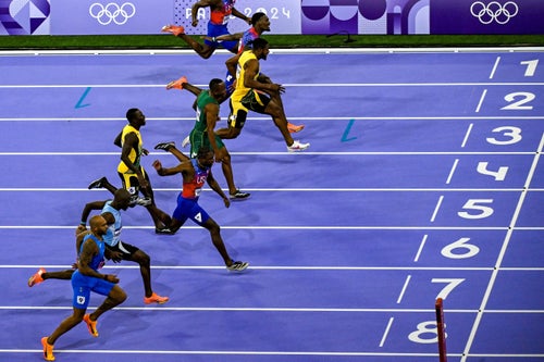 (From bottom) Botswana's Letsile Tebogo, US' Noah Lyles, Jamaica's Oblique Seville, South Africa's Akani Simbine, Jamaica's Kishane Thompson, US' Fred Kerley and US' Kenneth Bednarek compete in the men's 100m final of the athletics event at the Paris 2024 Olympic Games at Stade de France in Saint-Denis, north of Paris, on August 4, 2024. (Photo by WANG Zhao / AFP) (Photo by WANG ZHAO/AFP via Getty Images)