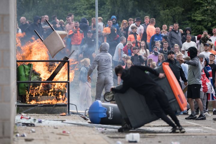 Anti-migration protesters attempt to enter the Holiday Inn Express Hotel which is housing asylum seekers in Rotherham, United Kingdom. (Photo by Christopher Furlong/Getty Images)