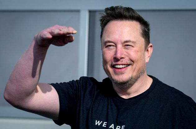 Elon Musk waves as he leaves the Tesla Gigafactory for electric cars in Gruenheide near Berlin earlier this year.