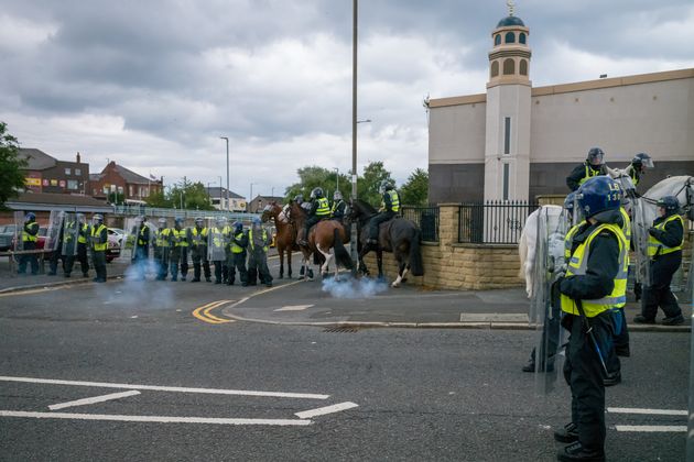 Riot police defend a Mosque in Sunderland as Far-right activists hold an Enough is Enough protest ion August 02, 2024.