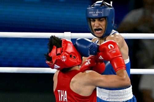 TOPSHOT - Thailand's Janjaem Suwannapheng and Algeria's Imane Khelif (Blue) compete in the women's 66kg semi-final boxing match during the Paris 2024 Olympic Games.