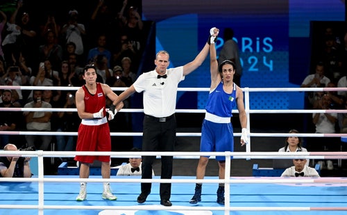 Referee Shawn Reese declares Imane Khelif of Algeria victorious over Janjaem Suwannapheng of Thailand in their women's 66kg semi-final bout. 