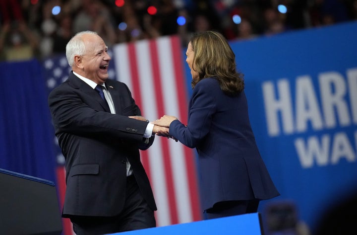 Vice President Kamala Harris and her newly announced running mate, Minnesota Gov. Tim Walz, appear onstage together during a campaign event at Girard College on Tuesday in Philadelphia, Pennsylvania.