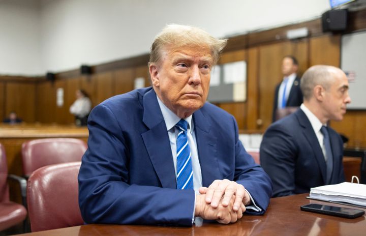 Former President Donald Trump awaits the start of proceedings on the second day of jury selection at Manhattan criminal court, April 16, 2024.