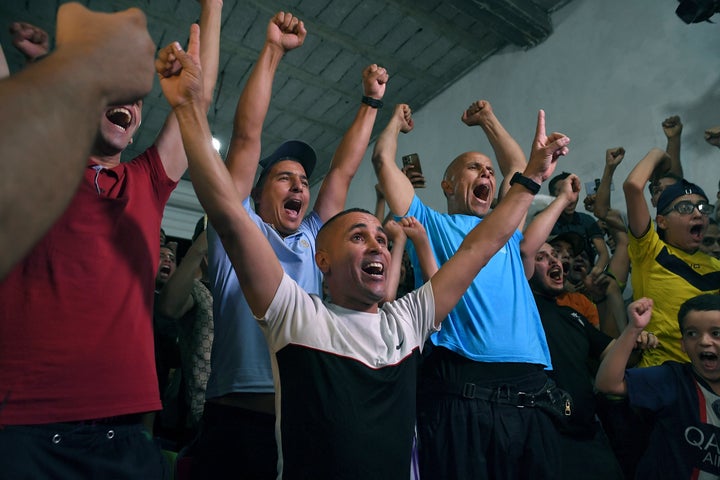 Supporters and relatives celebrate after watching Imane Khelif advance to the women's 66kg Olympic final, in Tiaret, Algeria, on Tuesday.