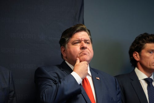 Illinois Gov. J.B. Pritzker stands with other officials during a security briefing at the U.S. Secret Service's Chicago Field Office on July 25, 2024, in Chicago. 