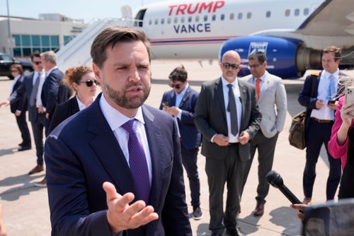 Sen. JD Vance (R-Ohio), the Republican vice presidential nominee, talks to reporters after walking over from looking at Air Force Two, Vice President Kamala Harris' plane, at Chippewa Valley Regional Airport, on Wednesday, Aug. 7, 2024, in Eau Claire, Wisconsin.