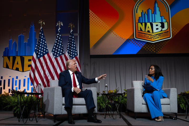 Former President Donald Trump answers a question from ABC congressional correspondent Rachel Scott on July 31 at the National Association of Black Journalists convention in Chicago. His remarks about Kamala Harris' identity drew jeers from the audience.