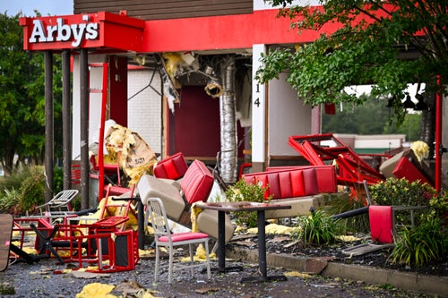 An Arby's restaurant looks devastated by a tornado associated with Tropical Storm Debby on Aug. 7, 2024 in Moncks Corner, South Carolina.