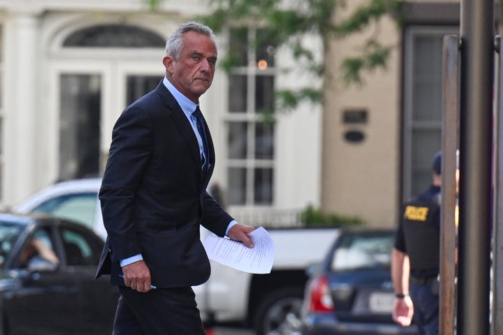 Independent presidential candidate Robert F. Kennedy Jr., right, arrives at the Albany County Courthouse on Wednesday, Aug. 7, 2024, in Albany, N.Y. (AP Photo/Hans Pennink)