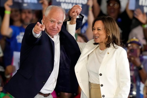 Democratic presidential nominee Vice President Kamala Harris and running mate Minnesota Gov. Tim Walz arrive at a campaign rally Wednesday, Aug. 7, 2024, in Romulus, Mich. (AP Photo/Carlos Osorio)