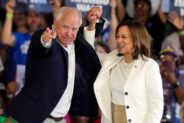 Democratic presidential nominee Vice President Kamala Harris and running mate Minnesota Gov. Tim Walz arrive at a campaign rally Wednesday, Aug. 7, 2024, in Romulus, Mich. (AP Photo/Carlos Osorio)