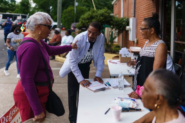 People attend a voter registration event on May 6, 2022, in Griffin, Georgia. 