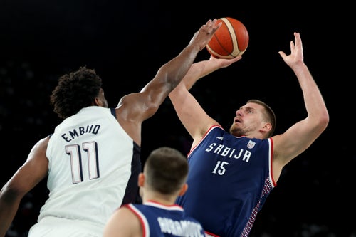 Joel Embiid of the United States and Nikola Jokić of Serbia.