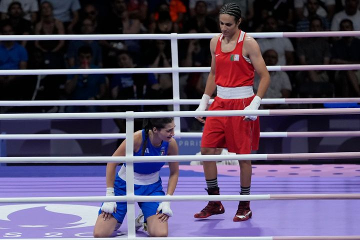 Algeria's Imane Khelif, right, defeats Italy's Angela Carini in their women's 66kg preliminary boxing match at the 2024 Summer Olympics, Thursday, Aug. 1, 2024, in Paris, France. (AP Photo/John Locher)