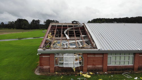 Debris from a tornado spun off by the remnants of Tropical Storm Debby, litters the campus of Springfield Middle School in Lucama, N.C., on Aug. 8, 2024.