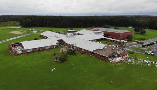Debris from a tornado spun off by the remnants of Tropical Storm Debby, litters the campus of Springfield Middle School in Lucama, N.C., on Aug. 8, 2024.