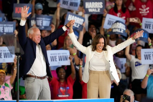 Democratic presidential nominee Vice President Kamala Harris and running mate Minnesota Gov. Tim Walz arrive at a campaign rally Wednesday, Aug. 7, 2024, in Romulus, Mich. (AP Photo/Carlos Osorio)