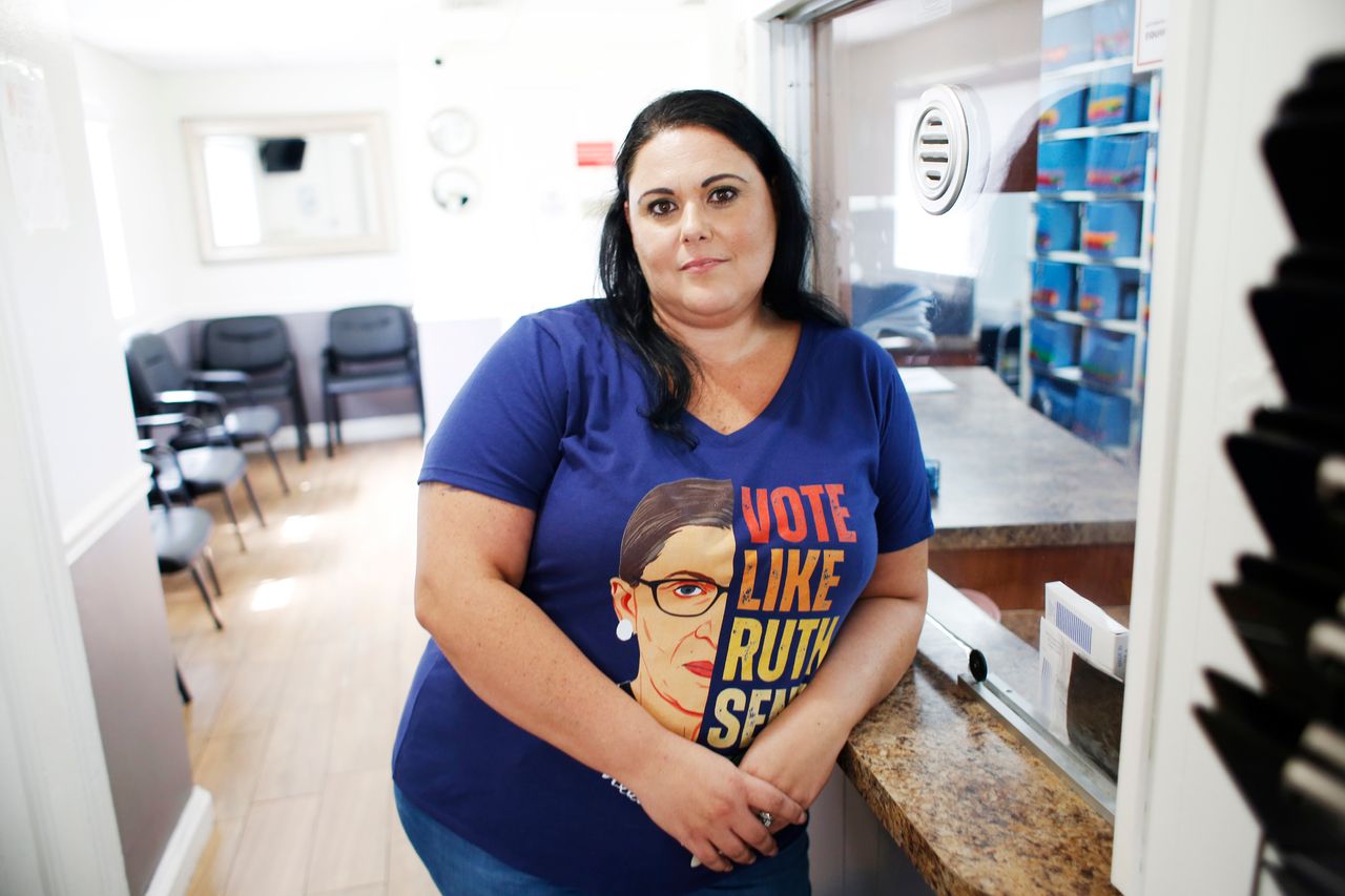 Julie Murano, the human resources director for the Center of Orlando for Women, poses for a portrait in Orlando on Aug. 7.