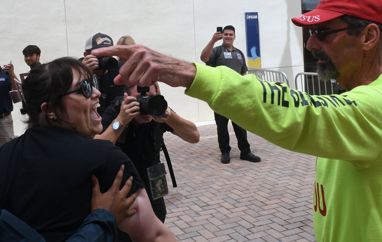 An anti-abortion protester clashes with an abortion rights supporter at Hillsborough Community College in Tampa, Florida.