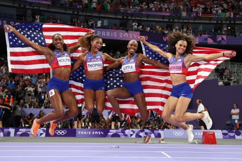 Alexis Holmes, Gabby Thomas, Shamier Little and Sydney McLaughlin-Levrone jump for joy after their resounding victory.