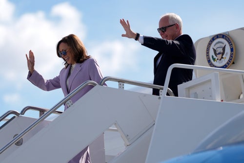 Democratic presidential nominee Vice President Kamala Harris and running mate Minnesota Gov. Tim Walz disembark from Air Force Two at Harry Reid International Airport, Saturday, Aug. 10, 2024, in Las Vegas. (AP Photo/Julia Nikhinson)