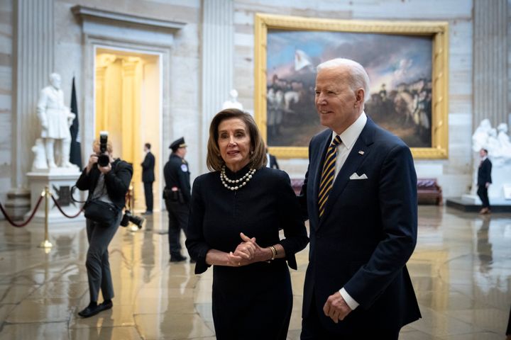 Nancy Pelosi greets President Joe Biden