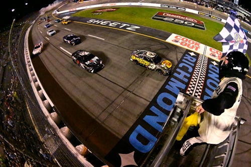 RICHMOND, VIRGINIA - AUGUST 11: Austin Dillon, driver of the #3 Bass Pro Shops Chevrolet, takes the checkered flag under caution to win the NASCAR Cup Series Cook Out 400 at Richmond Raceway on August 11, 2024 in Richmond, Virginia. (Photo by Logan Whitton/Getty Images)