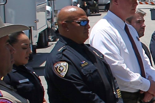 Uvalde School Police Chief Pete Arredondo (third from left) stands during a news conference outside Robb Elementary School on May 26, 2022, in Uvalde, Texas. 