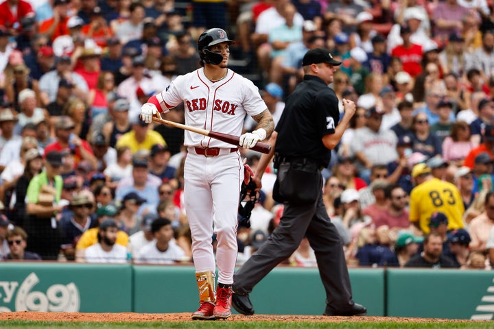 Jarren Duran walks back to the Red Sox dugout after an at bat against the Houston Astros at Boston's Fenway Park on Aug. 11, 2024. He has been suspended for two games for hurling a homophobic slur at a heckler during Sunday's game.